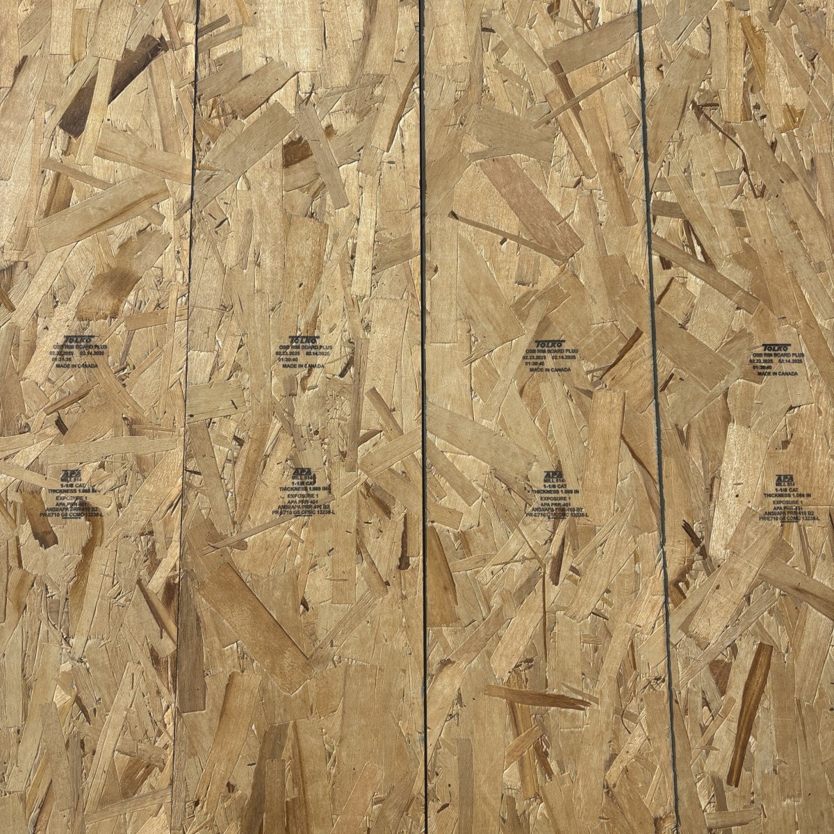Top-down view of OSB rim board face on 1-1/8 inch by 9-1/2 inch APA-rated structural rim board showing strand texture