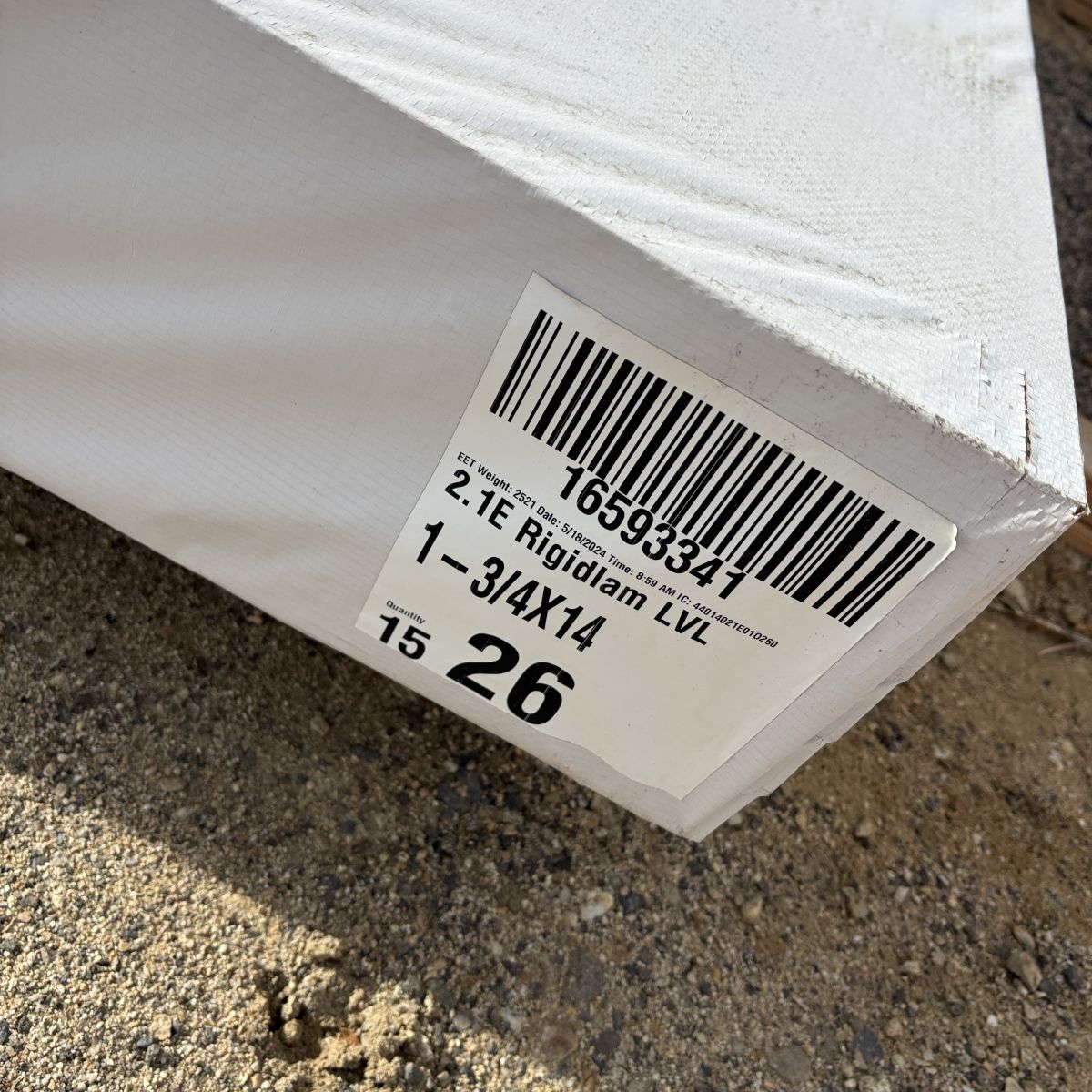 Close-up of manufacturer label on 1-3/4 inch by 14 inch laminated veneer lumber (LVL) beam stocked at Boise lumberyard