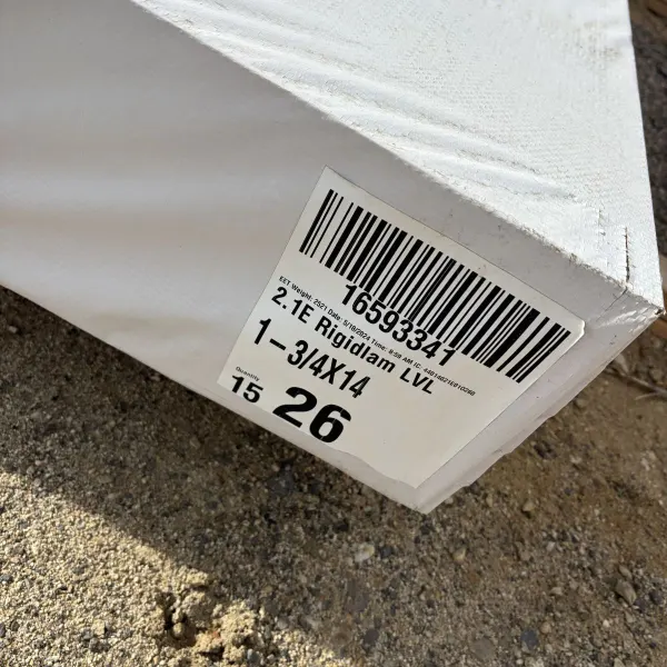 Close-up of manufacturer label on 1-3/4 inch by 14 inch laminated veneer lumber (LVL) beam stocked at Boise lumberyard