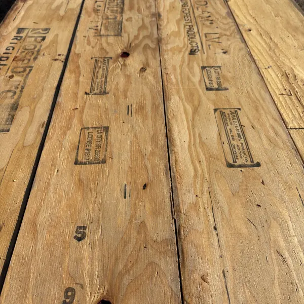 Close-up angled view of wood grain texture on 1-3/4 inch by 9-1/2 inch LVL showing layered veneer structure