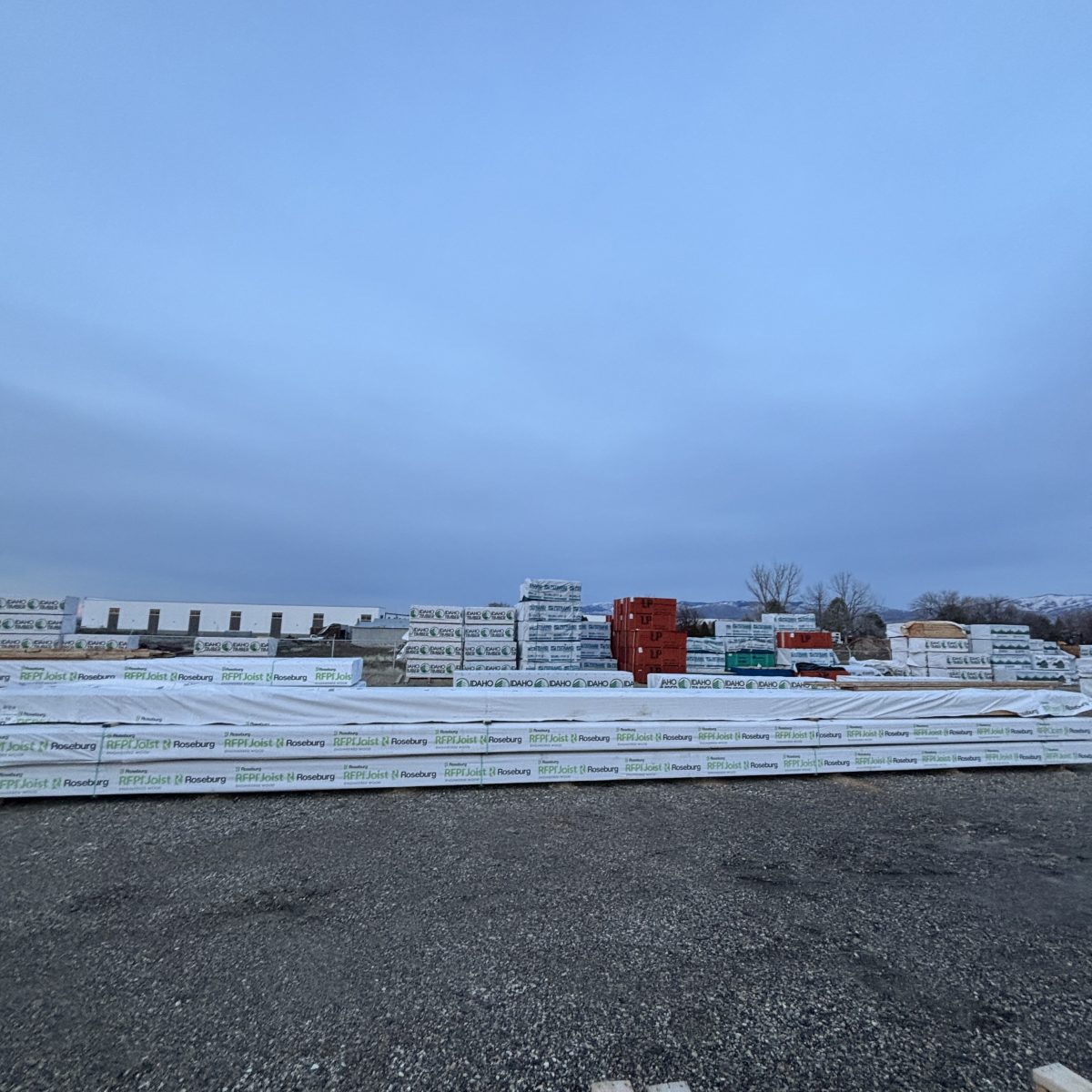 Roseburg RFPI-70 11-7/8 inch engineered wood I-joist shown in full-length mill-wrapped unit at Boise lumberyard