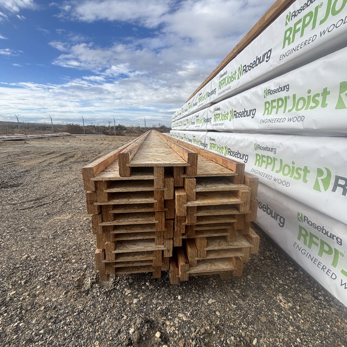 Unwrapped RFPI-90 11-7/8 inch engineered wood I-joist ends stacked at Boise lumberyard