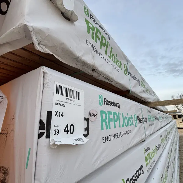 Stacked Roseburg RFPI-400 14 inch engineered wood I-joists with manufacturer labels visible at Boise lumberyard