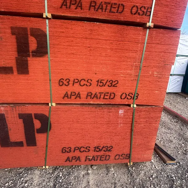Stacked 15/32 inch 4x8 OSB sheathing showing size printed on panels at Boise lumberyard