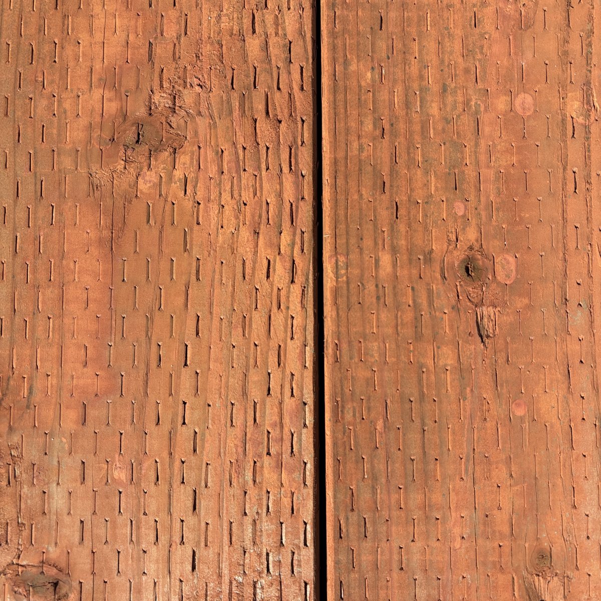 2x pressure-treated #2 fir lumber for ground contact, brown tone with incised surface at Dynamic Lumber Solutions yard