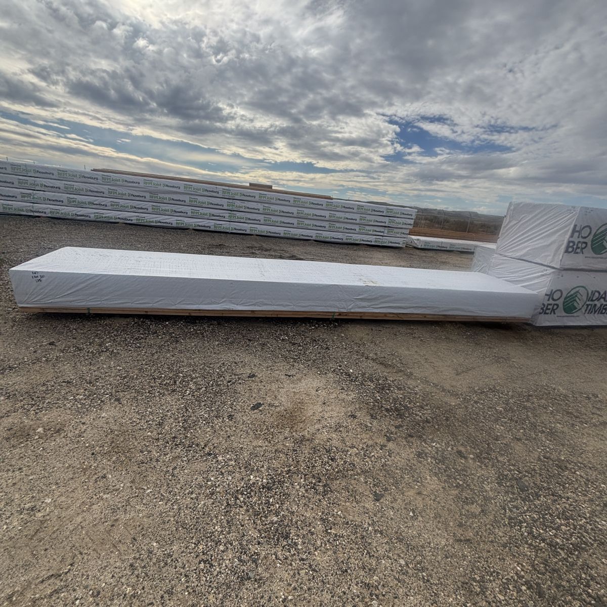 Polywrapped bunk of 2×4×20′ #2 kiln-dried hem-fir lumber staged at our Boise lumberyard
