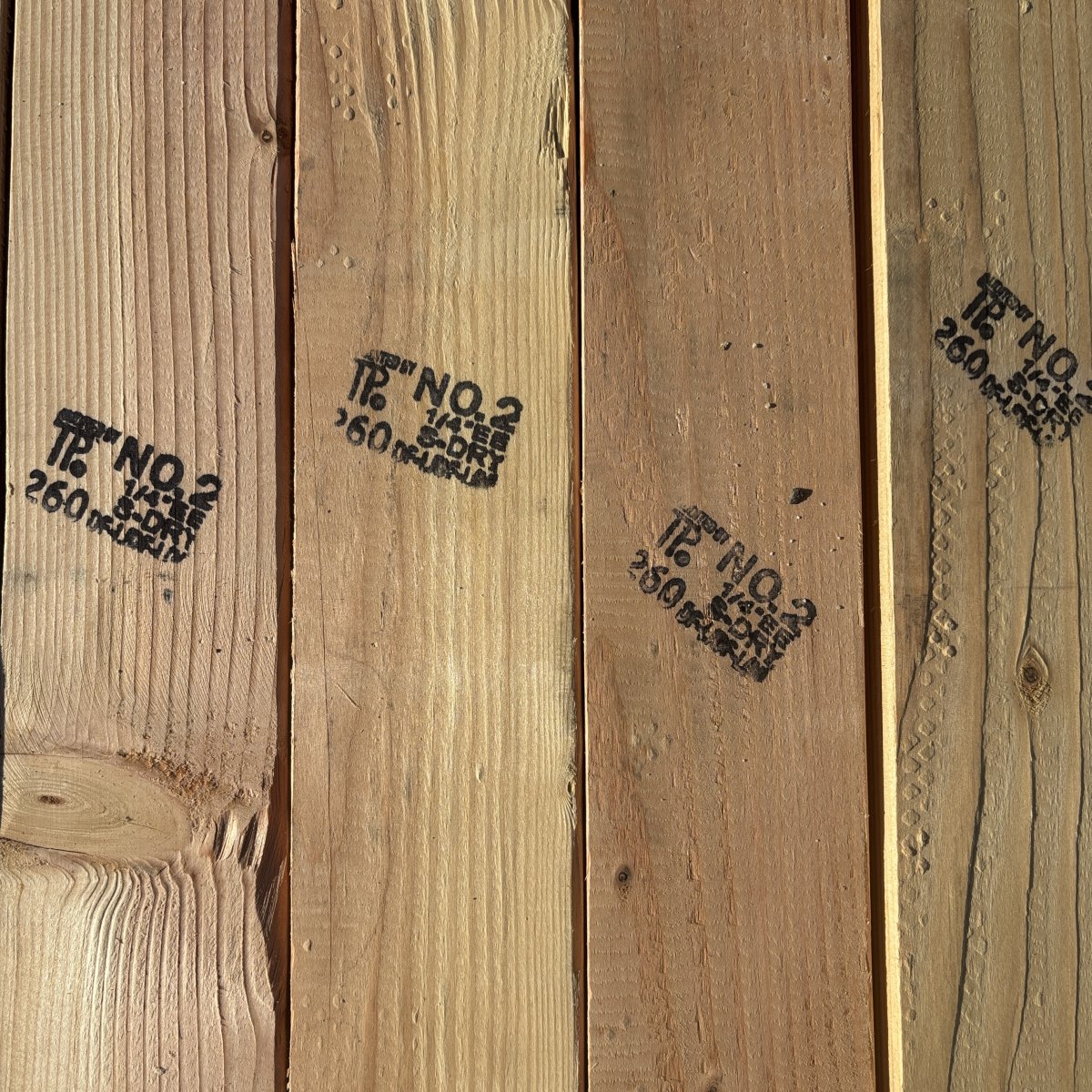 Grade stamp on 2×4 #2 kiln-dried Douglas Fir lumber showing grade and mill identification