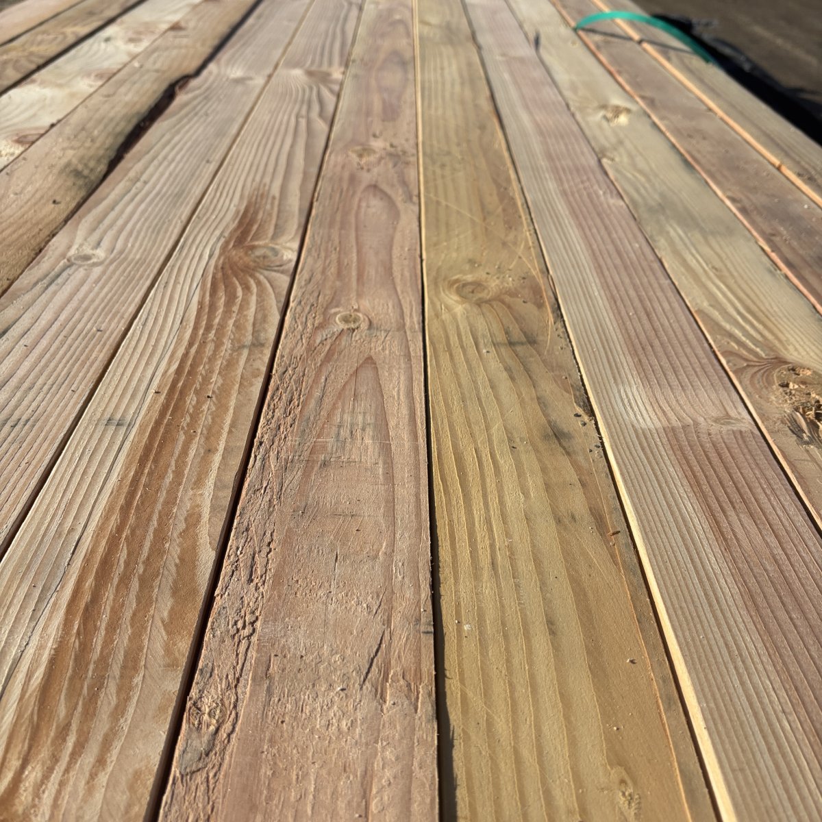 Close-up angled view of Douglas Fir wood grain on 2×4 #2 kiln-dried lumber showing natural texture and grain pattern