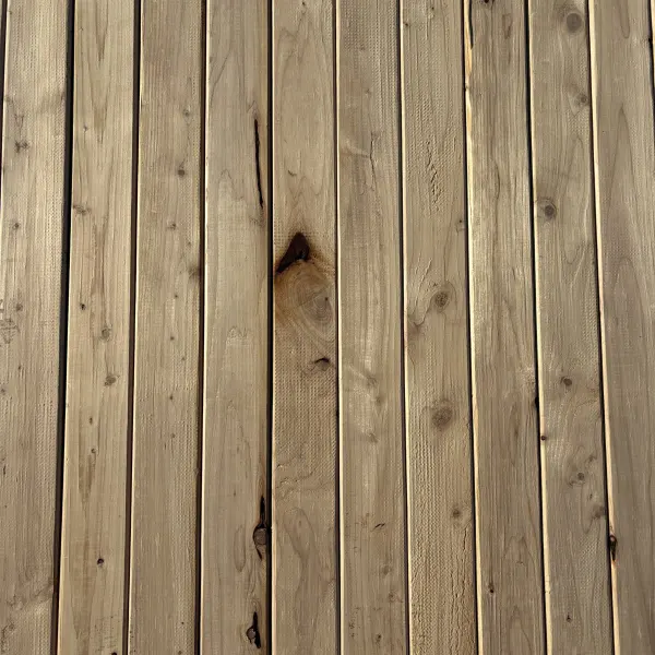 Top-down view of Hem-Fir wood texture on 2×4 #2 kiln-dried lumber showing grain pattern and surface detail