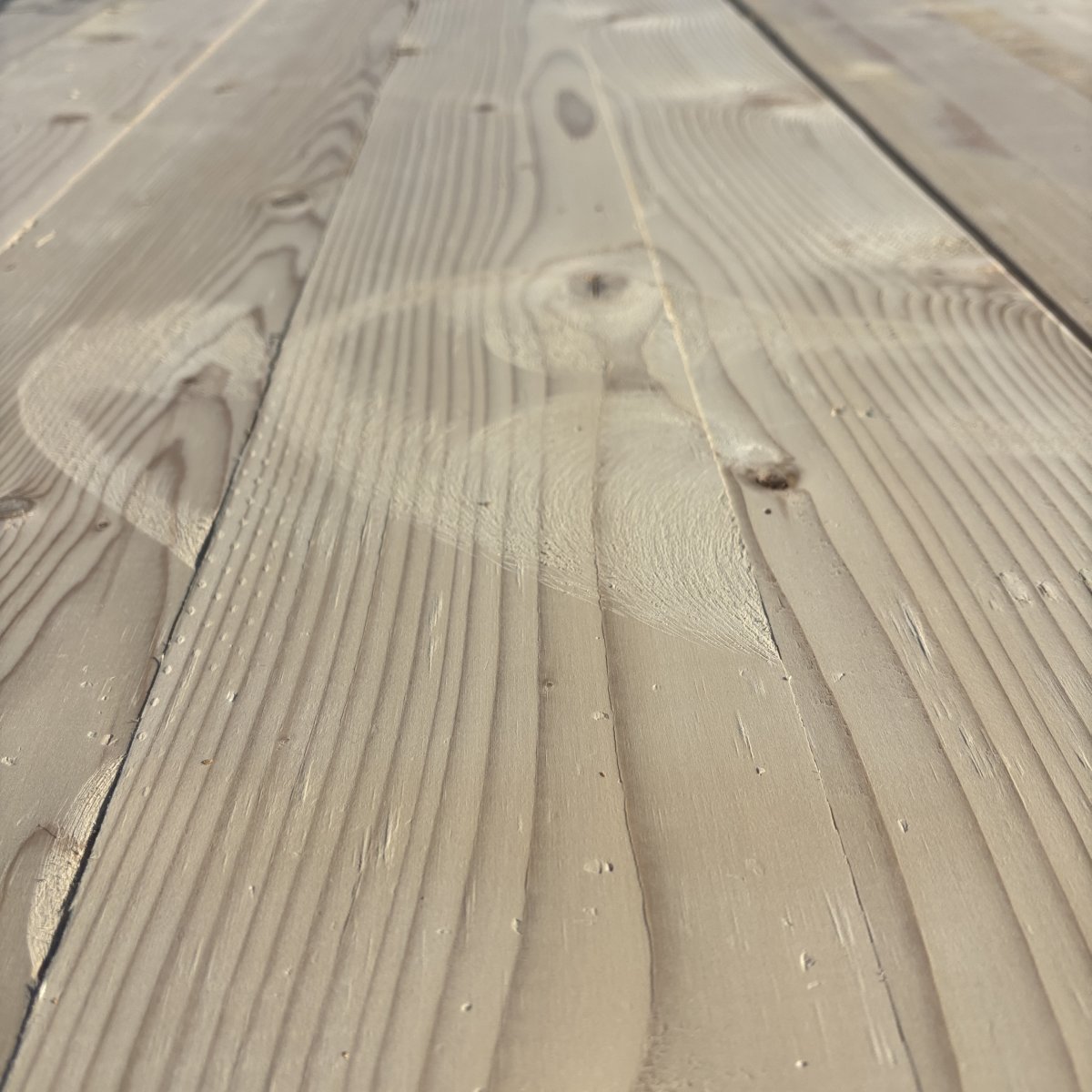 Close-up angled view of Hem-Fir wood grain on 2×6 #2 kiln-dried lumber showing natural texture and grain pattern