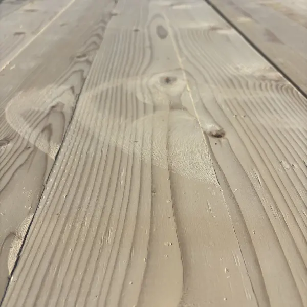 Close-up angled view of Hem-Fir wood grain on 2×6 #2 kiln-dried lumber showing natural texture and grain pattern