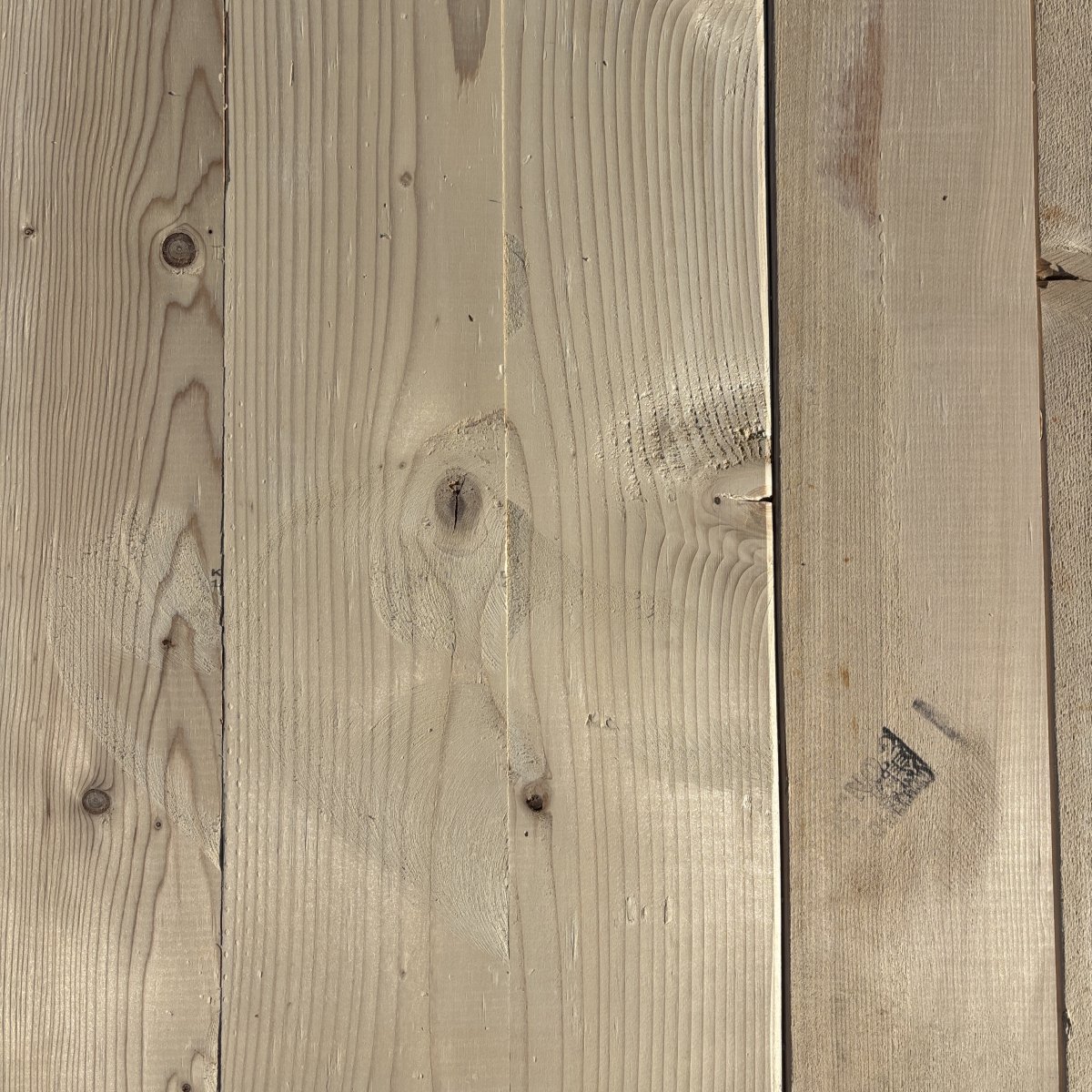 Top-down view of Hem-Fir wood texture on 2×6 #2 kiln-dried lumber showing grain pattern and surface detail