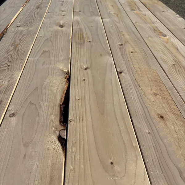 Close-up angled view of Hem-Fir wood grain on 2×8 #2 kiln-dried lumber showing natural texture and grain pattern
