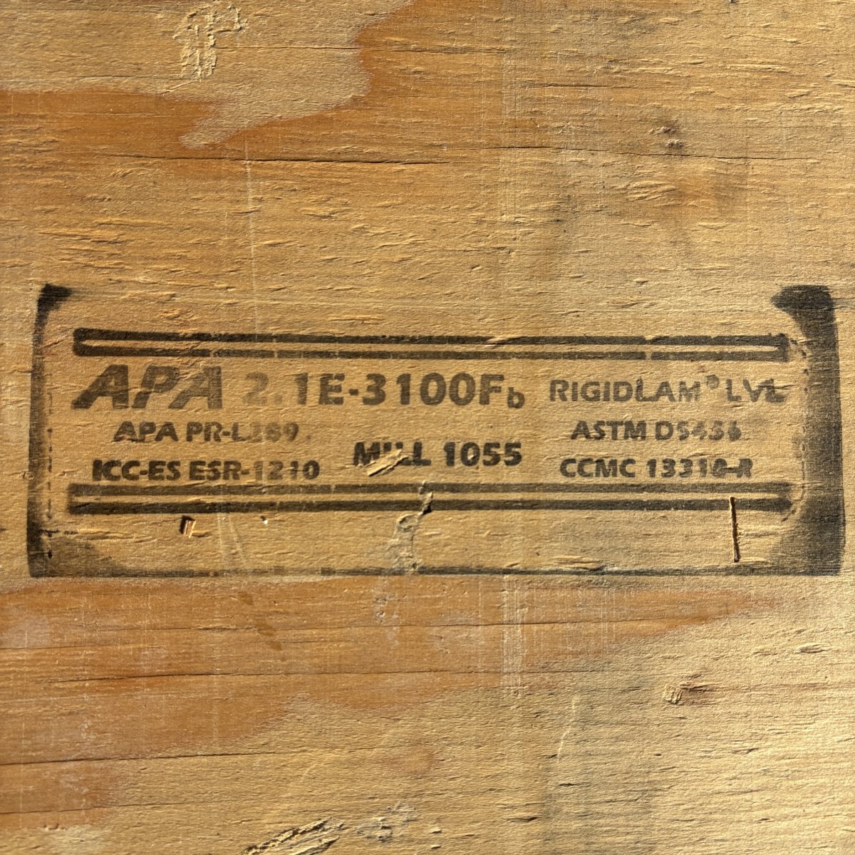 APA certification stamp on LVL beam showing 2.1E rating and structural grade information